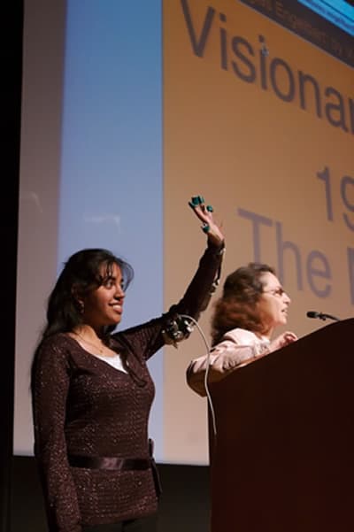 Nikitha presenting haptic glove research on stage